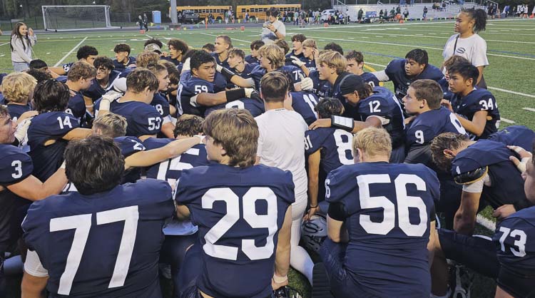 The Skyview Storm gathered for a player-led prayer after Saturday’s game, played in memory of their teammate William “Liam” Sloan, who passed away earlier in the week. Photo by Paul Valencia