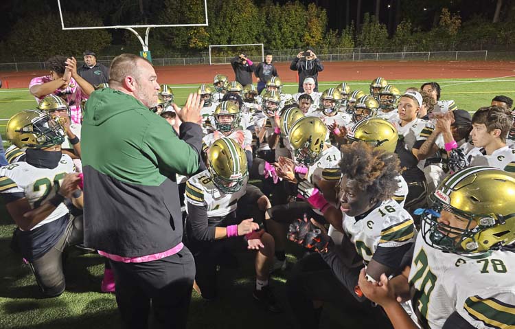 Evergreen coach Christian Swain said he did not want to talk too long after Friday's game, because this night belonged to the players. Evergreen clinched a league title in football for the first time since 2007. Photo by Paul Valencia