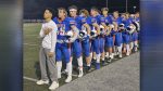 Brian McLemore III of Ridgefield High School recovers from a life-threatening injury, remaining an integral part of his football team.