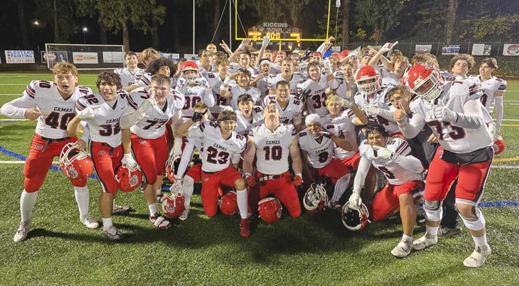 The Camas Papermakers celebrate their 2024 Class 4A Greater St. Helens League football title after defeating Skyview 24-14 on Friday. Photo by Paul Valencia