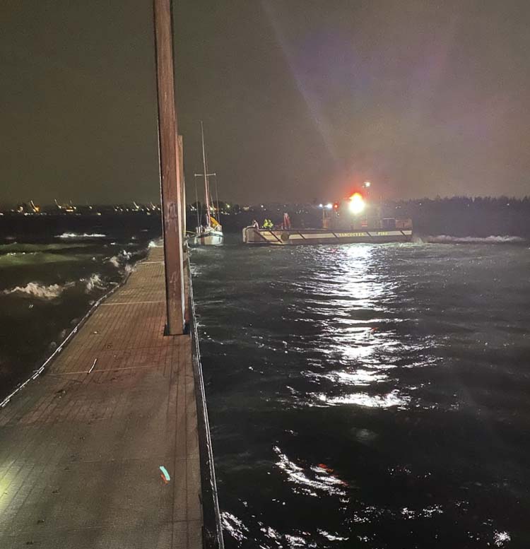 Vancouver Fire Department used Fire Boat 1 and a rescue swimmer Tuesday night to rescue a man and his dog off of a sail boat in treacherous waters on the Columbia River. Photo courtesy Vancouver Fire Department