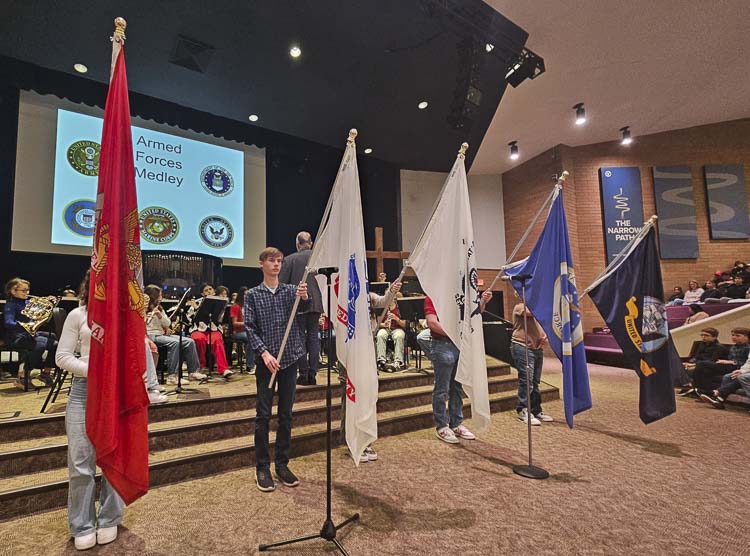 Students presented the flags of the military branches as the King’s Way Christian band performed the marches of each branch at Wednesday’s ceremony to honor veterans. Photo by Paul Valencia