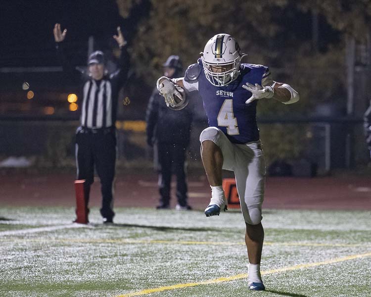 Jacob Williams of Seton Catholic shows off his moves in the end zone after one of his three touchdowns Saturday in the state semifinals. Williams rushed for two scores and returned an interception for a touchdown. Photo by Mike Schultz