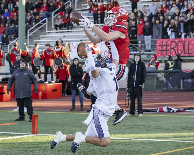 Chase McGee gets up to catch this touchdown pass for the Camas Papermakers. Photo by Mike Schultz