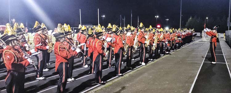 The Camas High School Marching Band performs the opposing team’s fight song at every home game, to welcome fans to Doc Harris Stadium. Photo by Paul Valencia