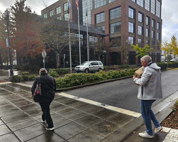 Justin Wood walks to City Hall with the box of signatures, courtesy of the efforts of Save Vancouver Streets.