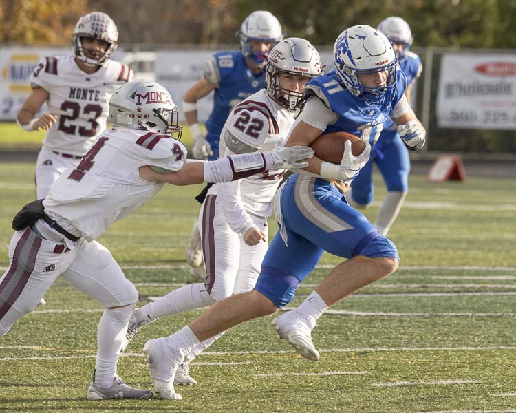 Parker McKinney of La Center breaks free for a long touchdown reception during the Wildcats’ game against Montesano at Woodland High School on Saturday. Photo by Mike Schultz