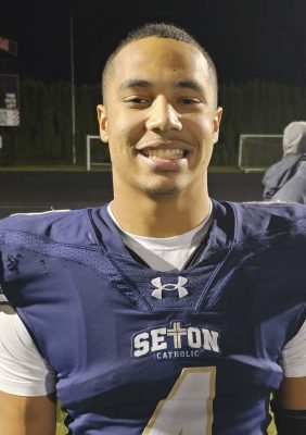 Jacob Williams of Seton Catholic said it was not a matter of if the Cougars were going to score the game-winning touchdown, it was a matter of how they were doing to score. Williams got the game-winner with 43 seconds to play Saturday night in the state quarterfinals. Photo by Paul Valencia