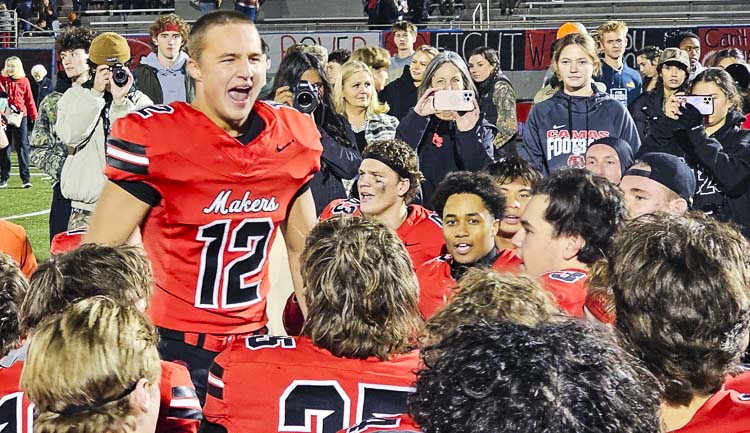 Beau Harlan fires up his teammates after the Camas Papermakers improved to 10-0 this season with a win Friday night at Doc Harris Stadium. Photo by Paul Valencia