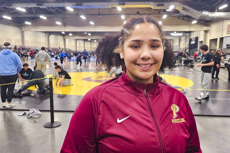 Faith Tarrant of Prairie is proud to be part of the growth in girls wrestling. She and her teammates are competing at the prestigious Pac Coast Wrestling Championships at the Clark County Event Center this week. Photo by Paul Valencia