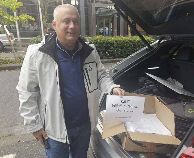 Justin Wood of Save Vancouver Streets gets ready to turn in thousands of signatures to City Hall for an initiative. The grassroots organization had a very big year in 2024. Photo by Paul Valencia