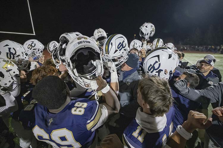 Seton Catholic, shown here celebrating its semifinal victory last week, finished second in the state in Class 1A football this season. The Cougars fell to state powerhouse Royal in the championship game Friday. Photo by Mike Schultz