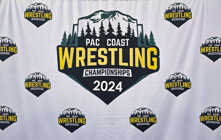 This year’s champions will get their photos taken in front of this banner for the Pac Coast Wrestling Championships. Photo by Paul Valencia