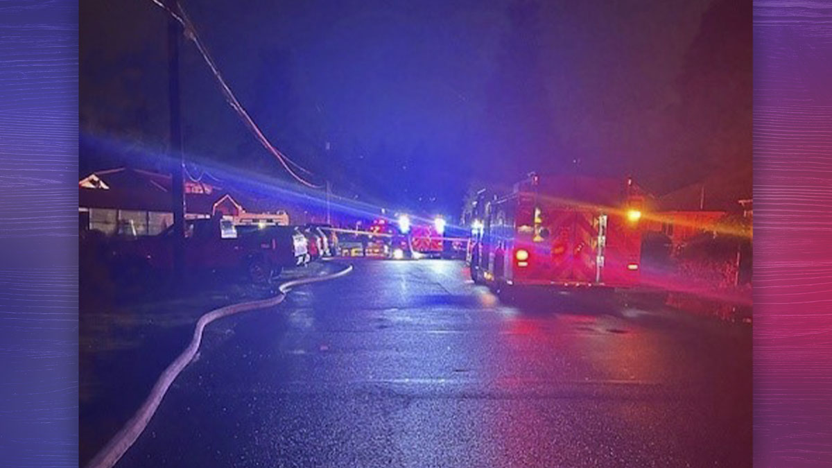 A downed high-voltage power line caused a Vancouver house fire, injuring a victim and three firefighters.