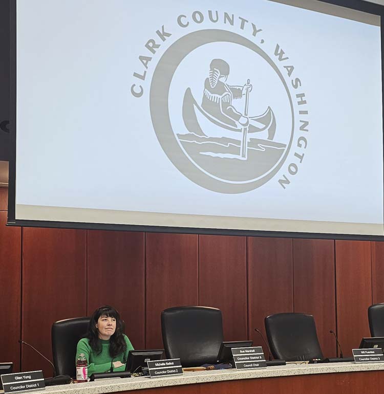 Michelle Belkot sits alone, a few minutes before the start of Tuesday’s Clark County Council Meeting. Photo by Paul Valencia