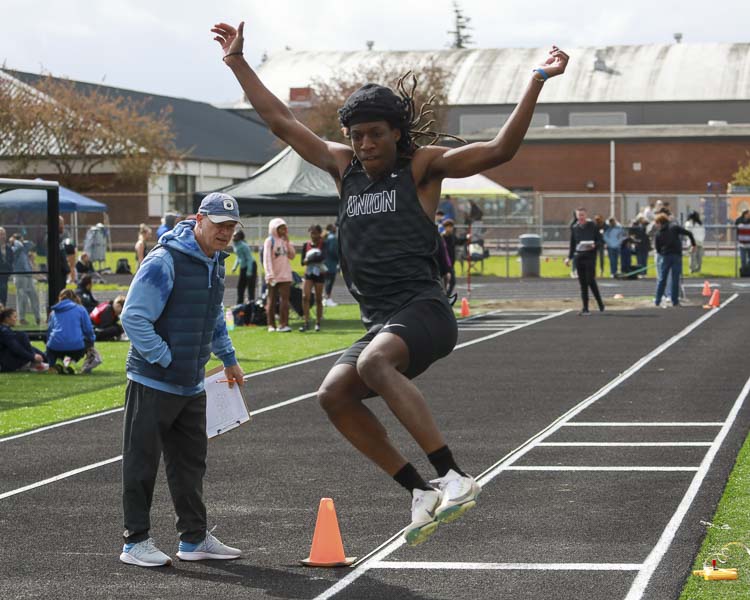 Tre McGee of Union takes flight in the long jump Saturday at the Tiger Invite in Battle Ground. Photo courtesy Chris Barker
