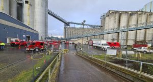 Vancouver firefighters responded to a grain fire in a ship loader at the Port of Vancouver, safely extinguishing the flames with support from multiple crews.